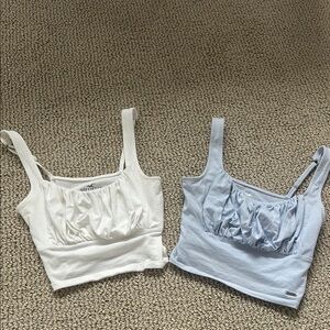 Two Pack of Hollister Ruched Bust Cropped Tanks in White and Light Blue